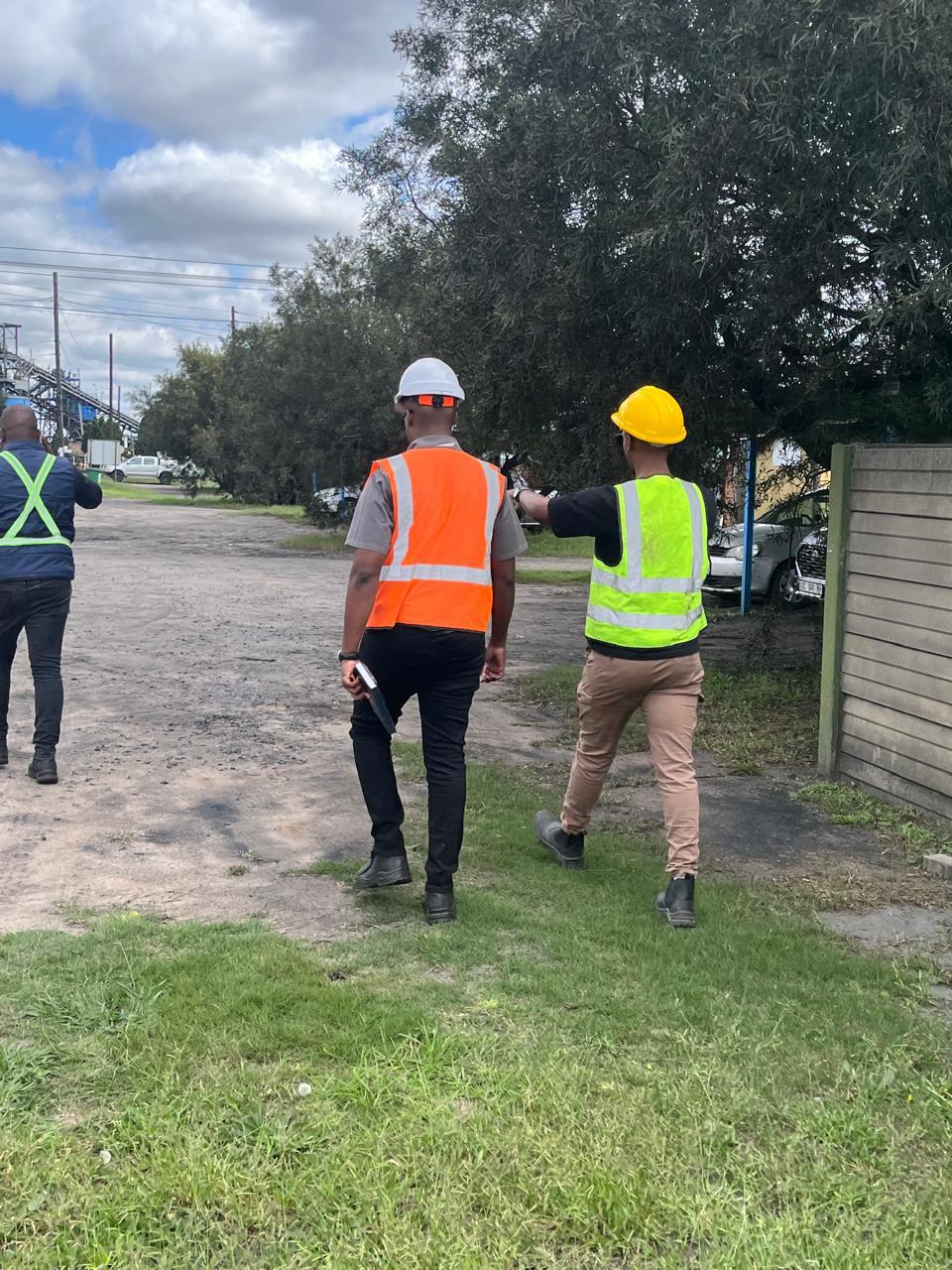 Team members walking through an industrial site